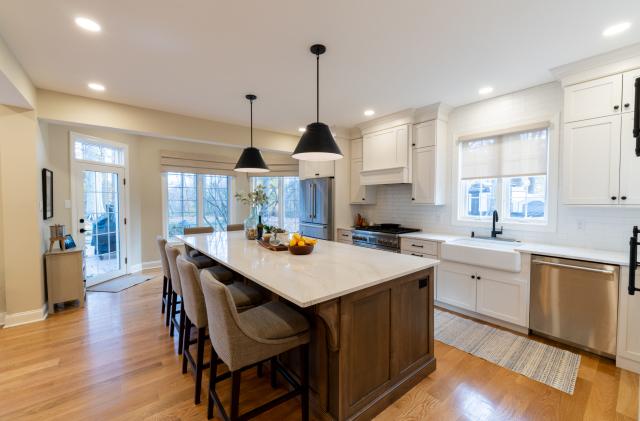 We removed the existing carpet and finished the hardwood floors beneath to match neighboring floors and create a warm, inviting living space.