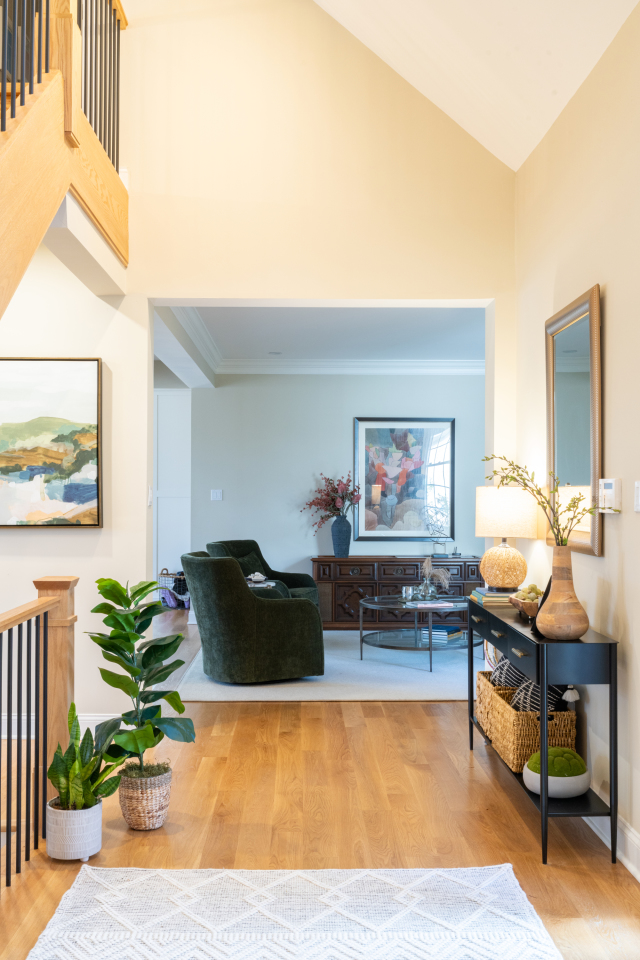 Powder Room Vanity and Mirror
The custom vanity features soft-close drawers and sleek black hardware, paired with a frameless mirror for a modern touch.