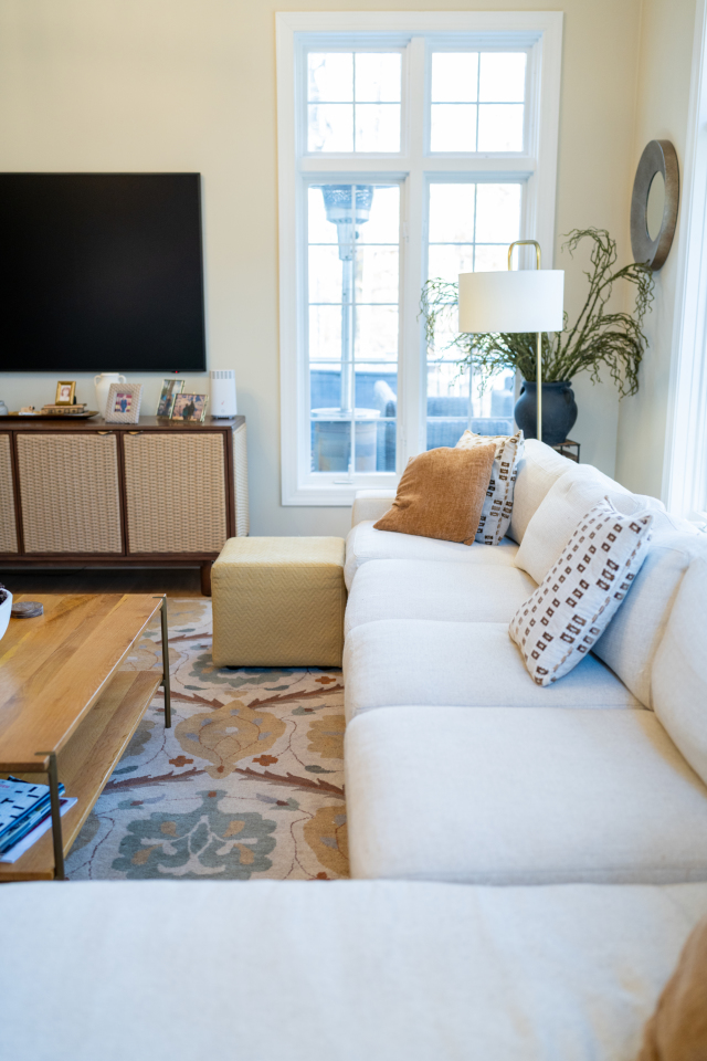 Bright Dining Area and Peninsula
The redesigned peninsula integrates storage and counter space, with the granite finish extending into the dining area for a unified design. Consistent flooring and recessed lighting connect the spaces seamlessly.