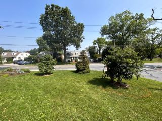 Existing lawn corner before native plant bed installation in Wilmington, DE