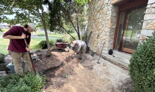 One Thousand Hands Horticulture crew preparing the ground beside the front door after removing old paving