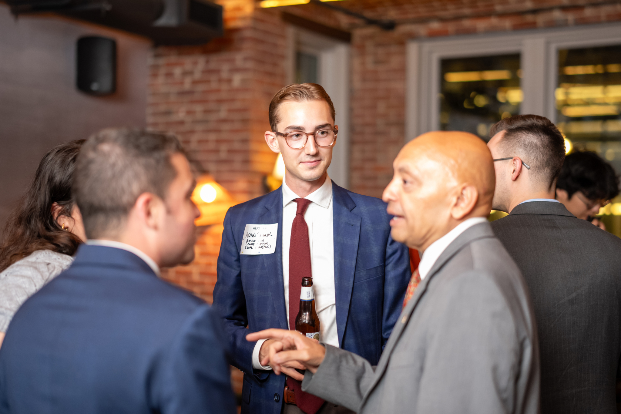 Networking attendees photographed with clearer facial detail, natural colors, and more balanced lighting