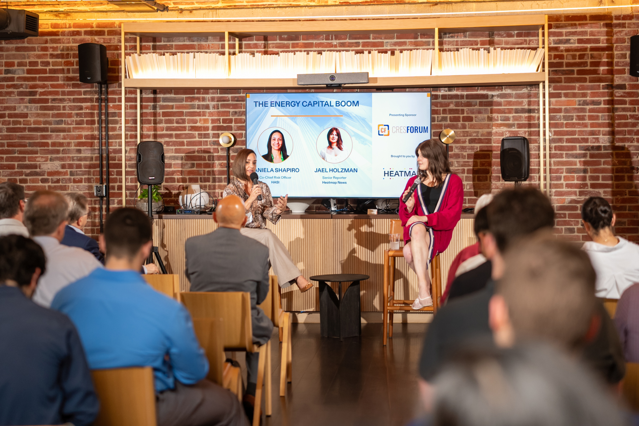 Panel discussion photographed with controlled lighting, producing clearer subjects and more balanced colors